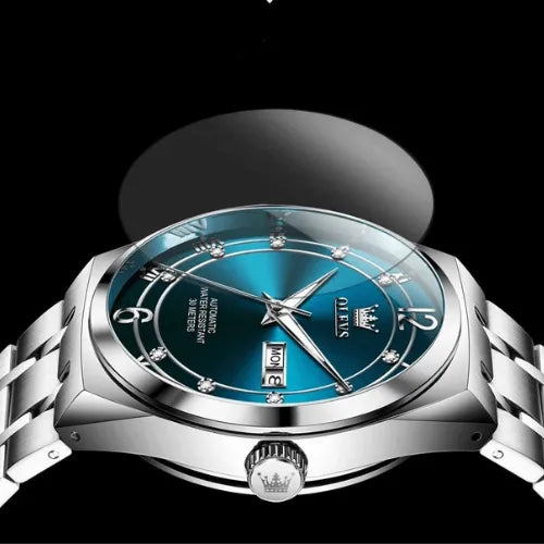 Men’s automatic watch with striking blue dial and silver bracelet.