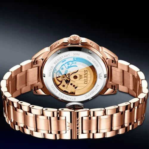 Rose gold automatic men’s watch with transparent back case revealing self-winding mechanical movement.