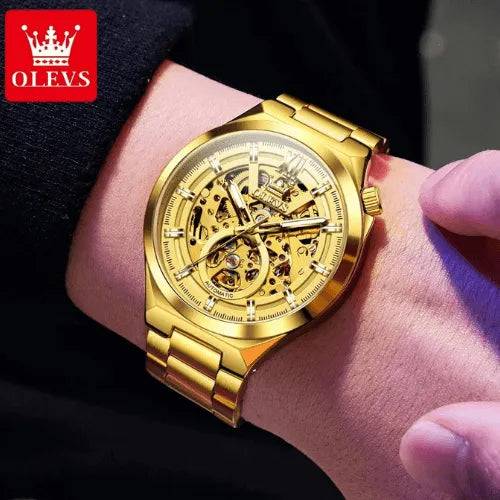 Elegant OLEVS gold skeleton automatic watch showcased on wrist, luminous details and golden stainless steel bracelet.
