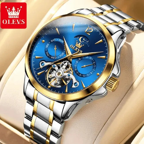 Luxury automatic men’s watch featuring a blue face, moon phase complication, skeleton flywheel, and two-tone strap.