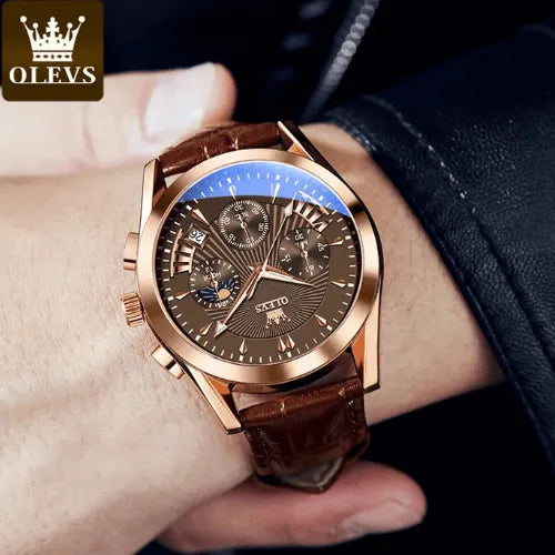 Brown dial chronograph watch with leather strap worn on wrist, rose gold case detail.