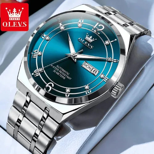 Classic men’s silver automatic watch with luminous blue dial.