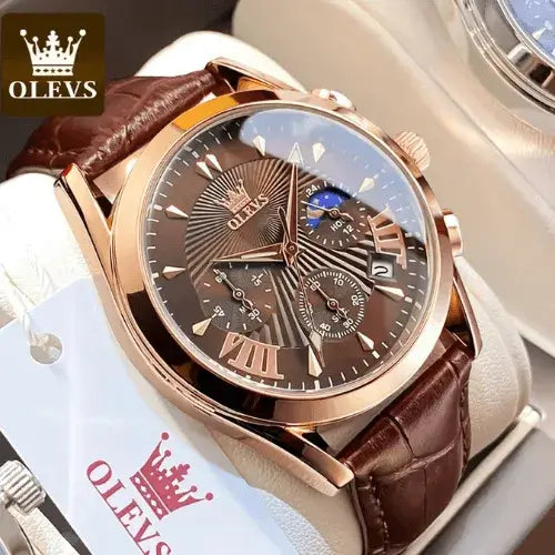 Elegant men’s chronograph leather strap watch in rose gold with moonphase feature close-up.