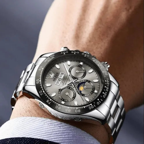 Business style grey dial men’s watch with stainless steel strap and luminous markers.