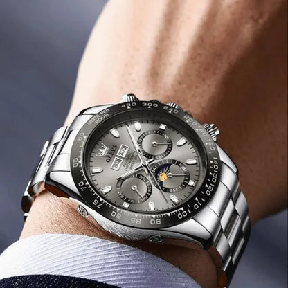 Business style grey dial men’s watch with stainless steel strap and luminous markers.