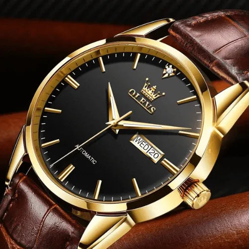 Elegant OLEVS automatic men’s watch with black dial, gold case and brown leather strap.