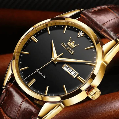 Elegant OLEVS automatic men’s watch with black dial, gold case and brown leather strap.