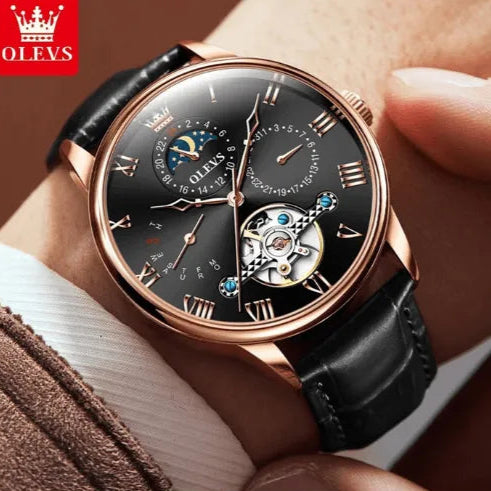 Elegant men’s rose-gold automatic watch with black leather strap, moon phase and open-heart tourbillon movement.