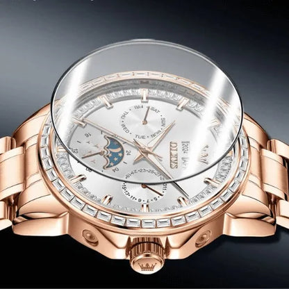Close-up of rose gold men’s automatic watch highlighting sapphire crystal and detailed moon phase dial.