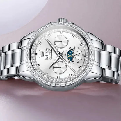 Silver stainless steel men’s luxury automatic watch with moon phase and multiple sub-dials, photographed flat.