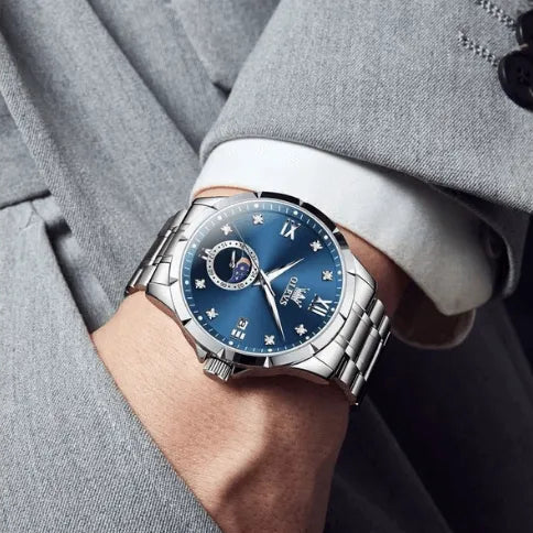 Elegant OLEVS business quartz watch in blue dial with moon phase and luminous hands.