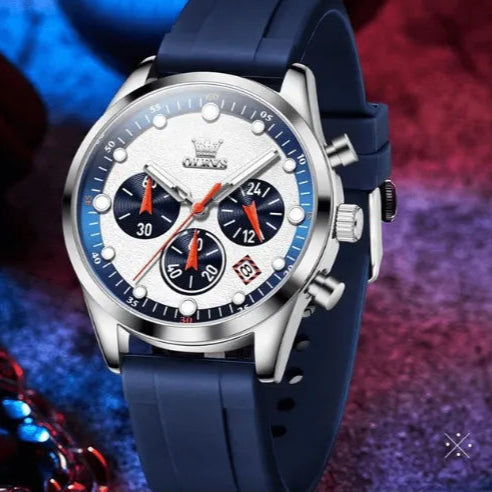 Stylish OLEVS chronograph men’s watch with blue strap displayed in a lifestyle setting.