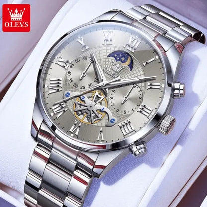 OLEVS men’s stainless steel silver moon phase watch displayed on cushion with polished bracelet.