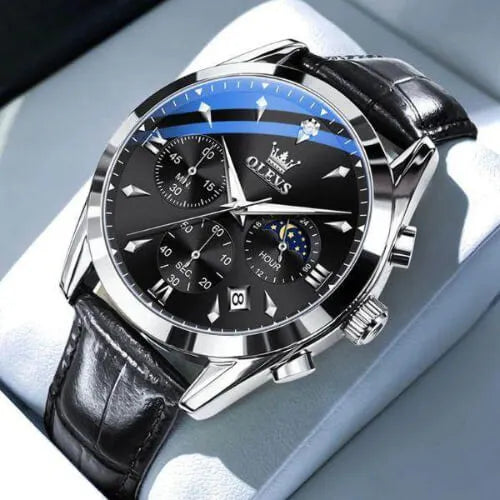 Close-up of the OLEVS Prestige Chronograph Black Silver watch featuring a black dial, three chronograph sub-dials, moon phase indicator, and black leather strap with polished stainless-steel case.