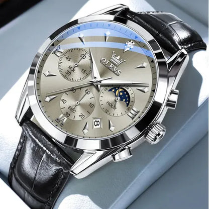 Close-up of the OLEVS Prestige Chronograph Silver White watch featuring a silver dial, moon phase indicator, three sub-dials, date window, and black leather strap with polished stainless-steel casing.