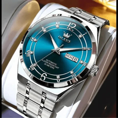 Modern blue and silver automatic wristwatch with day-date function.