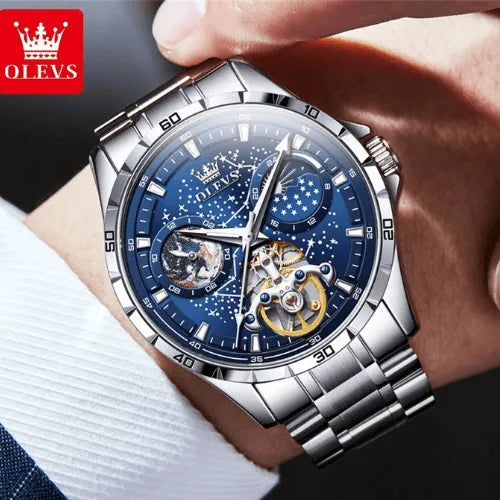 Stainless Steel Sky Dial Watch on wrist with starry blue face and tourbillon feature.