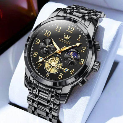 Luxury Titan men’s chronograph watch in black and gold with moon phase and engraved flywheel detail.
