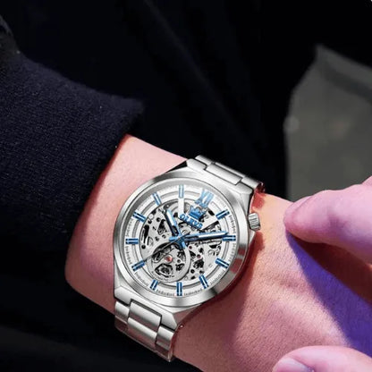 White Skeleton Automatic wristwatch with stainless steel bracelet shown on wrist for luxury style.