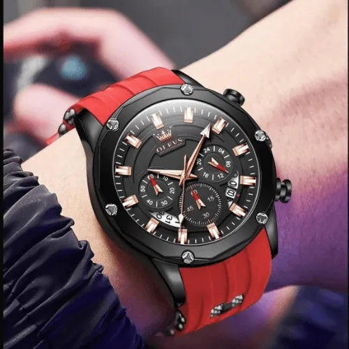 Men’s Flame Racer chronograph sports watch with red strap and multifunction dial, worn on wrist.