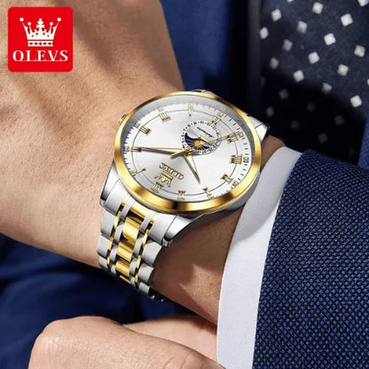 Silver and gold OLEVS automatic wristwatch for men worn with blue suit.